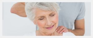 Elderly woman getting chiropractic care